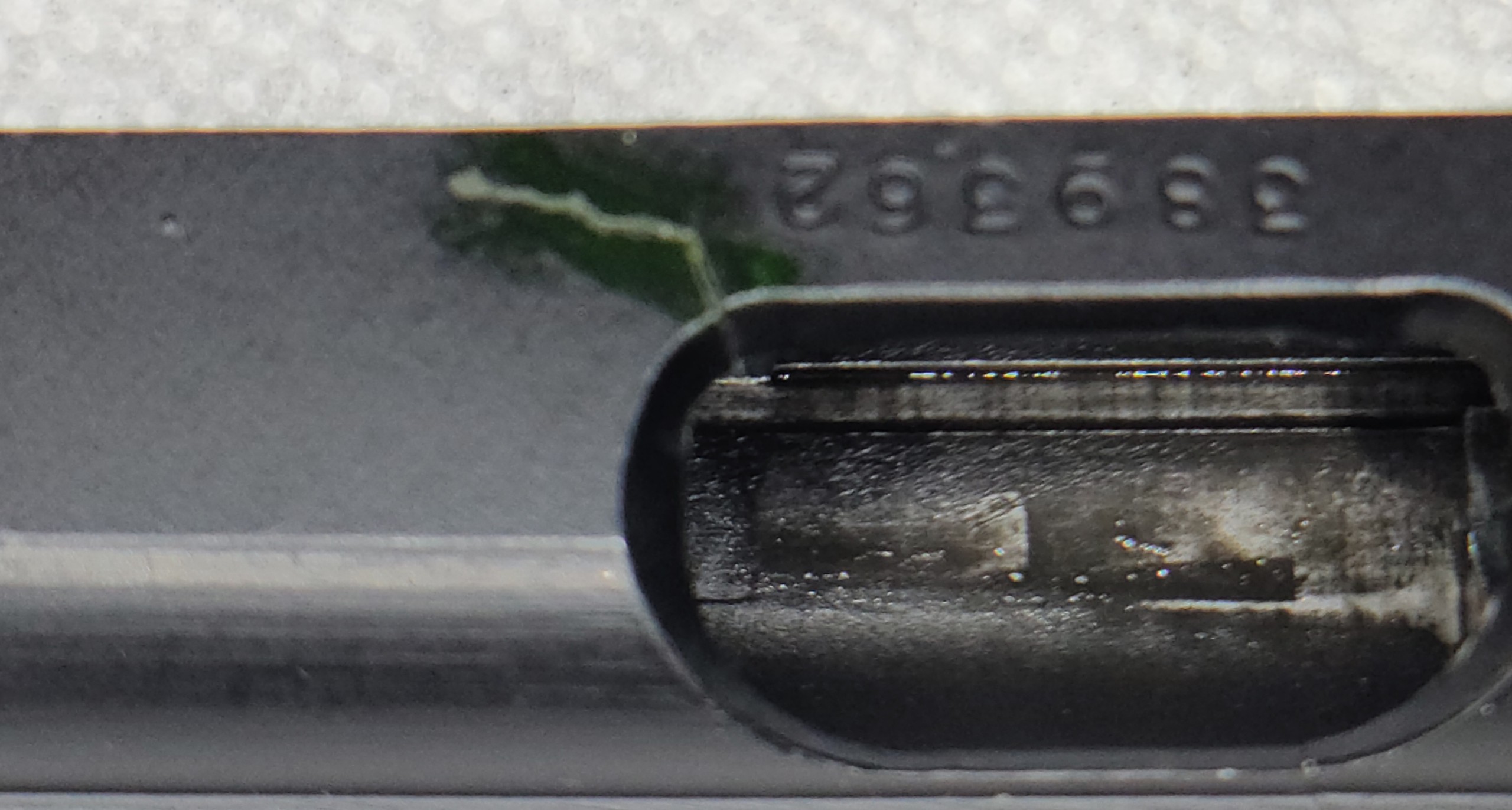Gun with crack at ejection port and slide