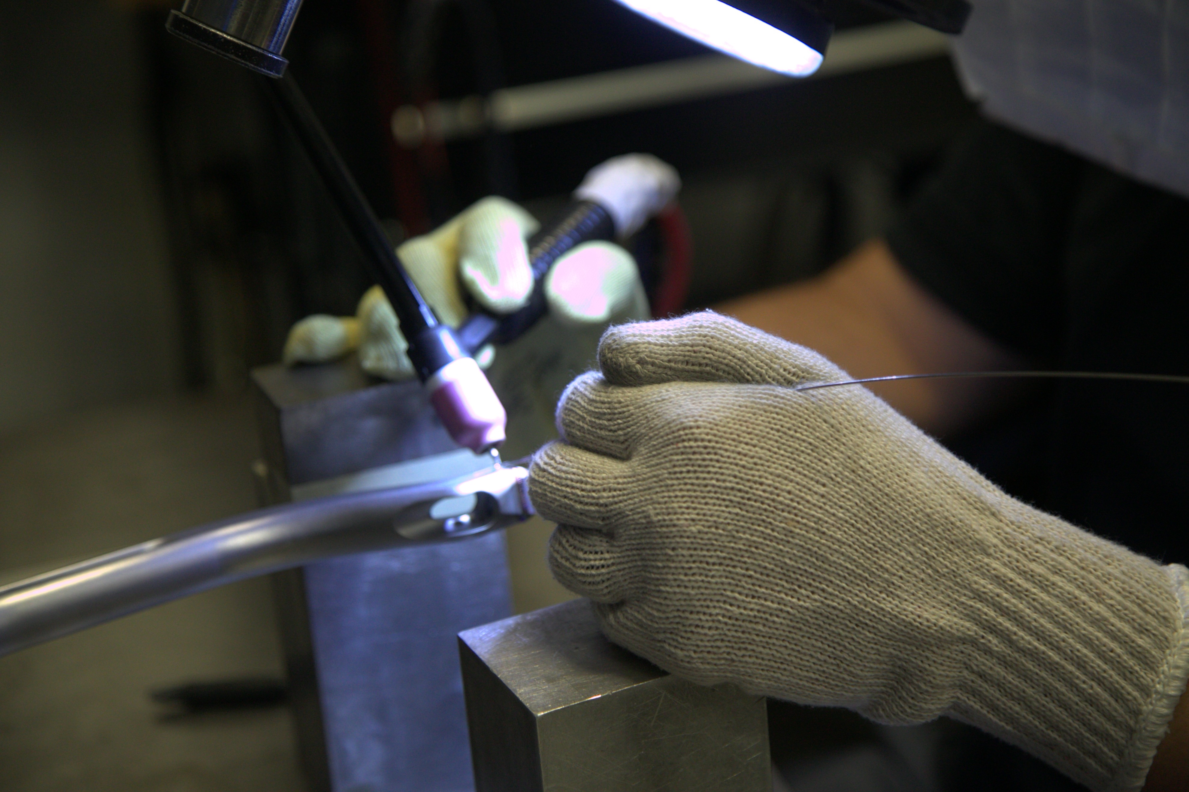 Microtech's employee performing precision microwelding