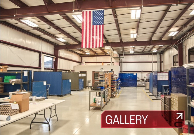 Interior of Microtech Welding Corp Fort Wayne location with machinery and American flag.