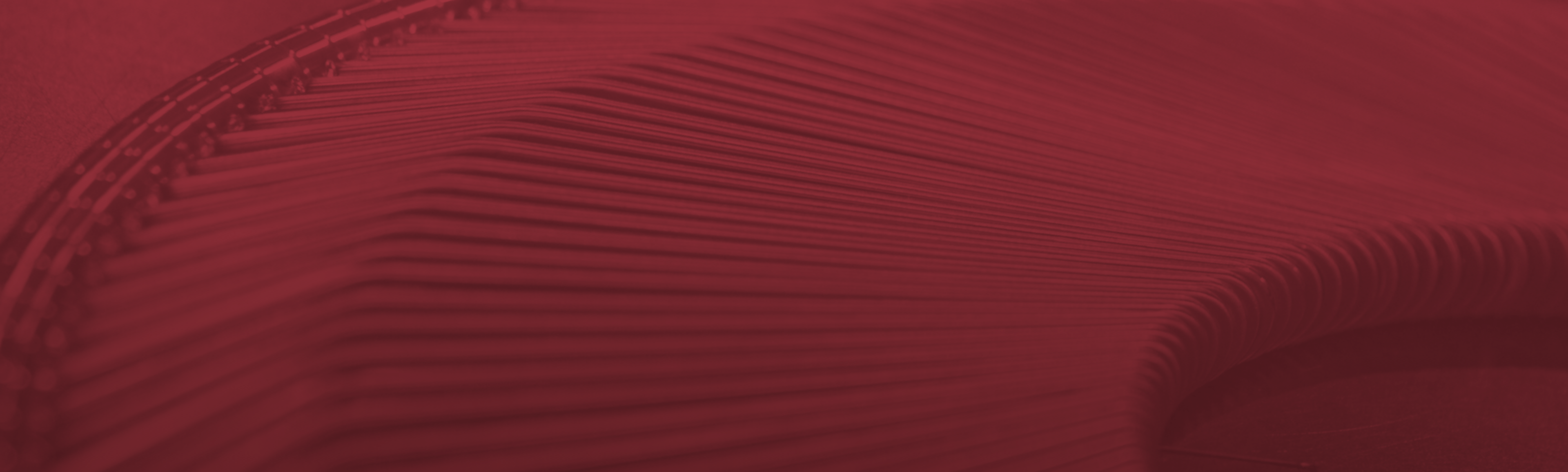 Latest News at Microtech Welding Corp Maroon overlay on welded Microtech parts background